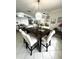 The dining room features an elegant chandelier and ample seating at 2095 Ellery St, Port Charlotte, FL 33952