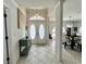 Bright entryway showcases tile floors, double doors, and an adjacent dining room at 2095 Ellery St, Port Charlotte, FL 33952