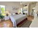 Main bedroom with wood floors, en-suite bathroom, and bright windows at 2095 Ellery St, Port Charlotte, FL 33952