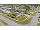 Aerial view of the home showcasing a well-manicured lawn and surrounding neighborhood at 2201 Birchcrest Blvd, Port Charlotte, FL 33952