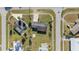Aerial view of a quiet residential neighborhood with well-maintained lawns and mature landscaping at 2201 Birchcrest Blvd, Port Charlotte, FL 33952
