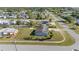Aerial view of the home showcasing a spacious yard and surrounding neighborhood at 2201 Birchcrest Blvd, Port Charlotte, FL 33952