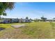 Expansive backyard, fire pit, and ample green space at 2201 Birchcrest Blvd, Port Charlotte, FL 33952
