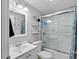 Well-maintained bathroom with a glass-enclosed shower, toilet, and sink, offering a clean and functional space at 2201 Birchcrest Blvd, Port Charlotte, FL 33952