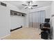 Simple bedroom offering a flexible space for personal use or storage with a window and ceiling fan at 2201 Birchcrest Blvd, Port Charlotte, FL 33952