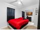 Cozy bedroom featuring a comfortable bed, TV, and neutral decor, creating a relaxing atmosphere at 2201 Birchcrest Blvd, Port Charlotte, FL 33952