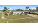 Charming single-story home with mature landscaping and a well manicured lawn at 2201 Birchcrest Blvd, Port Charlotte, FL 33952