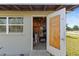 View of the inside of a storage shed with tools and shelving at 2201 Birchcrest Blvd, Port Charlotte, FL 33952