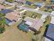 Aerial view of property showcasing backyard pool, lush landscaping, and a screened in lanai at 2333 Rio De Janeiro Ave, Punta Gorda, FL 33983