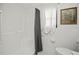 Bright white shower-tub combo with decorative wall art at 2333 Rio De Janeiro Ave, Punta Gorda, FL 33983
