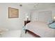 This bedroom features a ceiling fan, nightstand, and a comfortable armchair to relax and unwind at 2333 Rio De Janeiro Ave, Punta Gorda, FL 33983