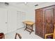 This room features a ceiling fan, light walls, and unique armoire with decorative touches at 2333 Rio De Janeiro Ave, Punta Gorda, FL 33983
