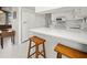 Modern kitchen with white cabinets and countertops at 2333 Rio De Janeiro Ave, Punta Gorda, FL 33983