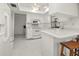 Bright kitchen boasts white appliances and updated countertops and flooring at 2333 Rio De Janeiro Ave, Punta Gorda, FL 33983