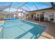 An inviting screened pool with ample patio space for lounging and entertaining at 2333 Rio De Janeiro Ave, Punta Gorda, FL 33983