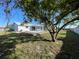 Backyard view of pool with screened lanai at 234 Shadow Nw St, Port Charlotte, FL 33952