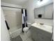 Updated bathroom featuring shower and tub combo, vanity and tile flooring at 234 Shadow Nw St, Port Charlotte, FL 33952