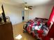 Bedroom features tiled floors and ceiling fan at 234 Shadow Nw St, Port Charlotte, FL 33952