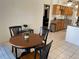 Dining area with tile flooring offering views into the kitchen area at 234 Shadow Nw St, Port Charlotte, FL 33952