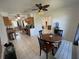 Open concept kitchen and dining area with tile flooring and multiple windows at 234 Shadow Nw St, Port Charlotte, FL 33952