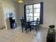 Light filled dining area features tile flooring and access to large windows at 234 Shadow Nw St, Port Charlotte, FL 33952