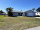 Single-story house with attached garage and manicured front lawn at 234 Shadow Nw St, Port Charlotte, FL 33952