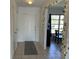 Hallway with tile floors and decorative lights, leading to the dining area at 234 Shadow Nw St, Port Charlotte, FL 33952
