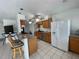 Modern kitchen featuring stone countertops and updated stainless steel appliances at 234 Shadow Nw St, Port Charlotte, FL 33952