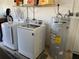 Laundry area with washer, dryer, and water heater at 234 Shadow Nw St, Port Charlotte, FL 33952
