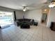 Relax in the living room with easy access to the outdoor pool area at 234 Shadow Nw St, Port Charlotte, FL 33952