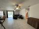 Spacious living room with sliding glass doors offering a view of the pool at 234 Shadow Nw St, Port Charlotte, FL 33952