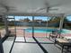 Screened patio offering a view of the pool area, perfect for relaxing at 234 Shadow Nw St, Port Charlotte, FL 33952