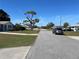 Residential street showcasing well-kept lawns and various home styles at 234 Shadow Nw St, Port Charlotte, FL 33952