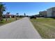 Neighborhood street view featuring neatly maintained front yards and diverse residences at 234 Shadow Nw St, Port Charlotte, FL 33952