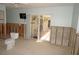 Bathroom awaiting renovations featuring exposed block wall, toilet, and sliding glass door at 285 Bal Harbor Blvd, Punta Gorda, FL 33950