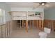 Unfinished bedroom with exposed framing and partial closets at 285 Bal Harbor Blvd, Punta Gorda, FL 33950