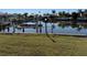 View of a private dock with boat lift on a canal, perfect for boating enthusiasts at 285 Bal Harbor Blvd, Punta Gorda, FL 33950