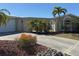 Well-maintained single-story home with landscaped front yard and concrete driveway on a sunny day at 285 Bal Harbor Blvd, Punta Gorda, FL 33950
