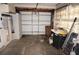 View of a cluttered two-car garage with ladder and cleaning supplies at 285 Bal Harbor Blvd, Punta Gorda, FL 33950