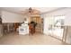 Open-concept kitchen featuring a white oven, tile floors, and access to the outdoors at 285 Bal Harbor Blvd, Punta Gorda, FL 33950