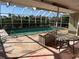 Outdoor pool area with a screened in patio and beautiful views at 285 Bal Harbor Blvd, Punta Gorda, FL 33950