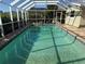 Screened-in pool area with clear water and tiled deck, great for relaxation and entertaining at 285 Bal Harbor Blvd, Punta Gorda, FL 33950