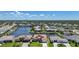 Gorgeous waterfront homes feature private docks along deep water canals in this aerial view with tropical landscaping at 341 Segovia Dr, Punta Gorda, FL 33950