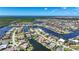 Expansive aerial view of a coastal community with homes situated along canals and waterways surrounded by lush greenery at 341 Segovia Dr, Punta Gorda, FL 33950