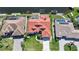 An aerial view of a single-Gathering home featuring a red tile roof, private pool, and waterfront access at 341 Segovia Dr, Punta Gorda, FL 33950