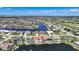 Panoramic aerial view shows homes on a waterfront neighborhood, with some residences having boat docks and private pools at 341 Segovia Dr, Punta Gorda, FL 33950