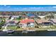 Aerial view depicts waterfront homes with pools, docks, and boat lifts, all connected by a network of navigable canals at 341 Segovia Dr, Punta Gorda, FL 33950