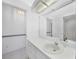 Bright bathroom featuring a large mirror, sink, and tile floors at 341 Segovia Dr, Punta Gorda, FL 33950