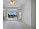 Bright bedroom with large windows offering a view of the pool and outdoor space at 341 Segovia Dr, Punta Gorda, FL 33950