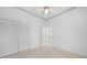 Neutral bedroom with a ceiling fan, closet, and adjacent doorway at 341 Segovia Dr, Punta Gorda, FL 33950